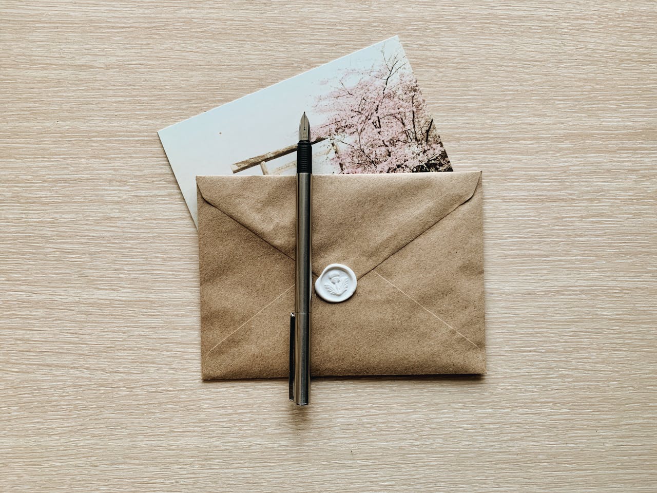 Overhead Shot of a Fountain Pen on a Sealed Envelope